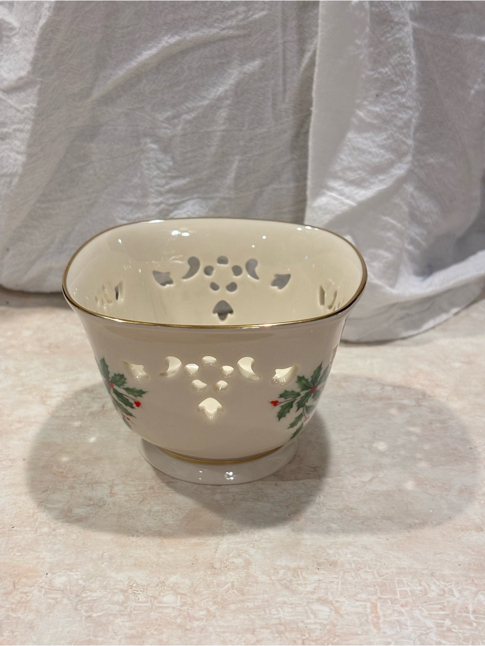 Lenox Holiday Dimension Porcelian Pierced Nut Dish with gold rim.